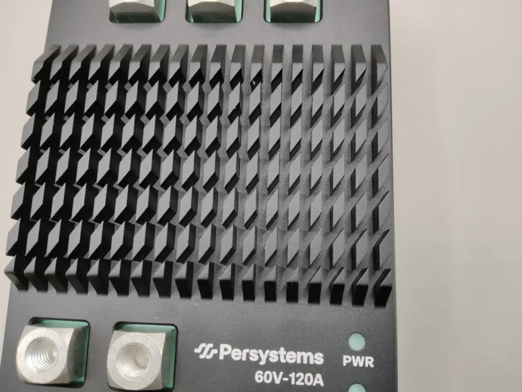 Heat sink of the INV-60V-120A inverter with pin fins, below it phase and DC terminals